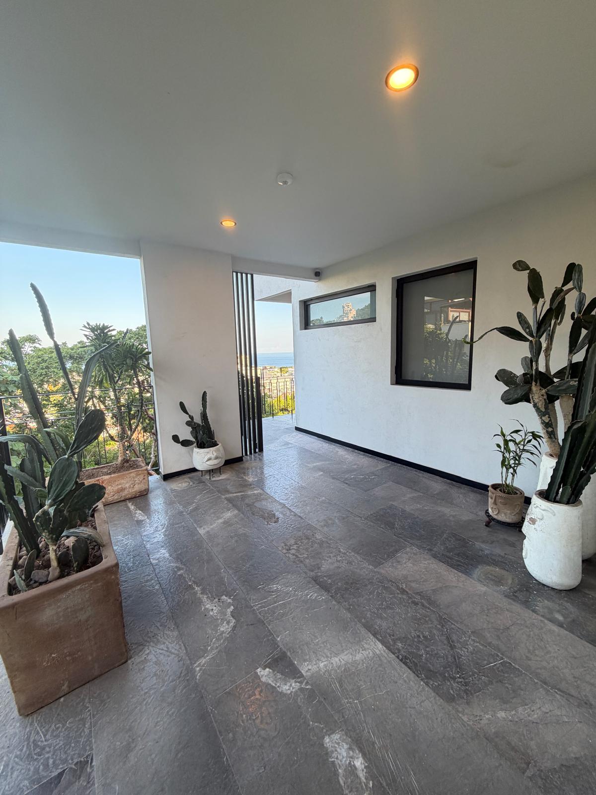 Covered entry walkway with ocean views