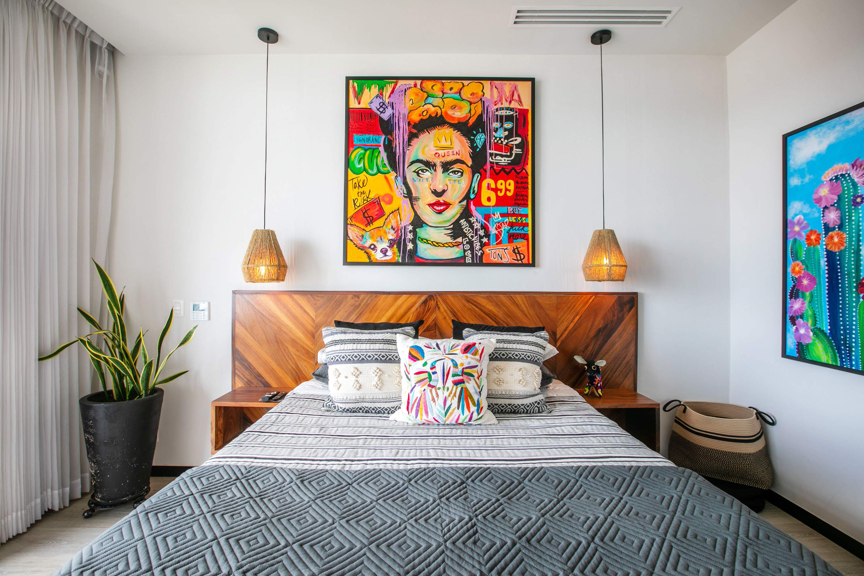 Primary bedroom with colorful artwork