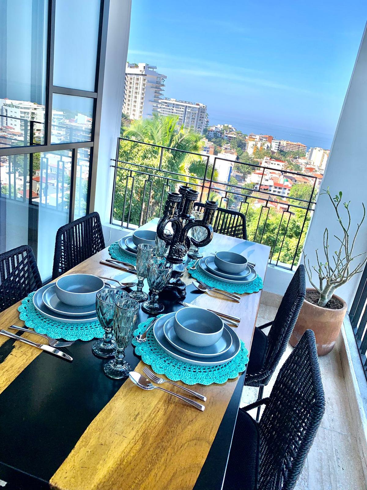 Terrace dining table set with bay views